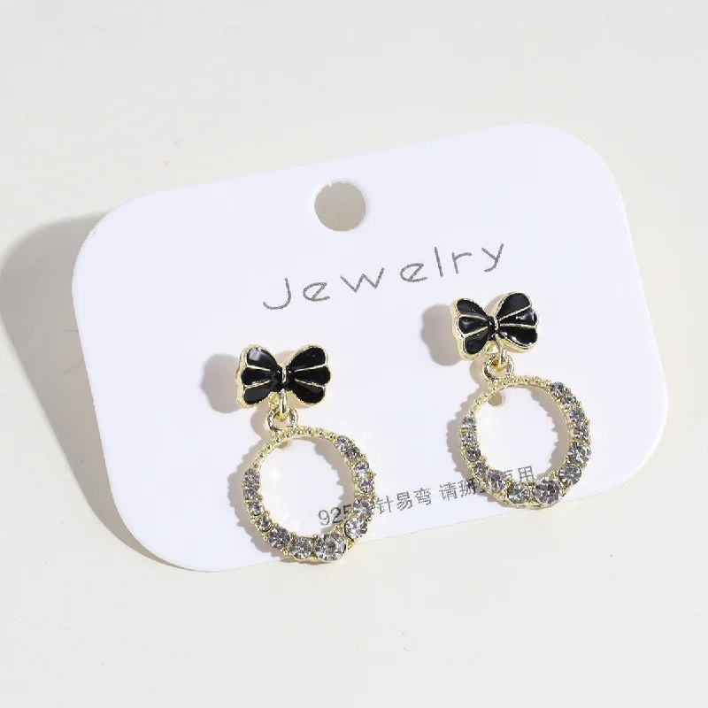 Black Bow Hollow Rhinestone Eardrops