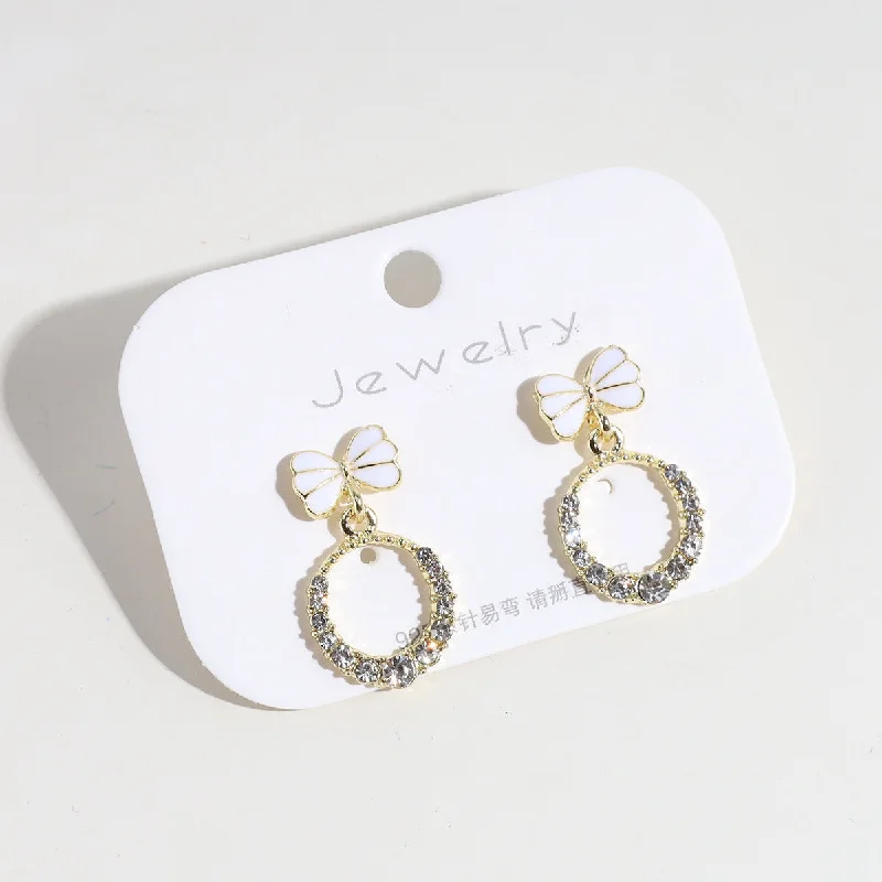 White Bow Hollow Rhinestone Eardrops